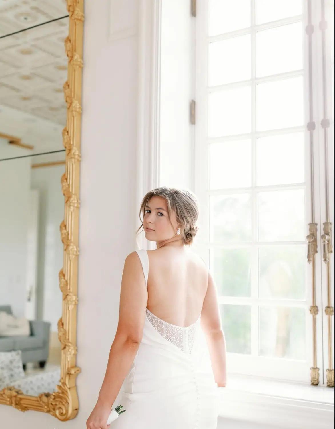 Сouple wearing a white gown and a black suit